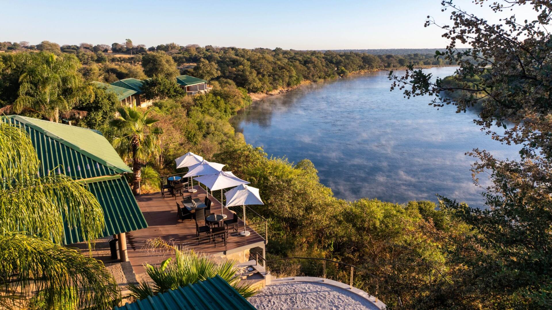 Simanya's deck and umbrellas above the Kavango River