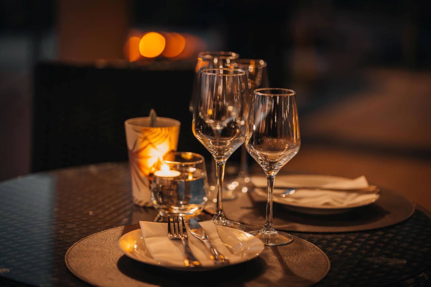 Wine glasses by candlelight