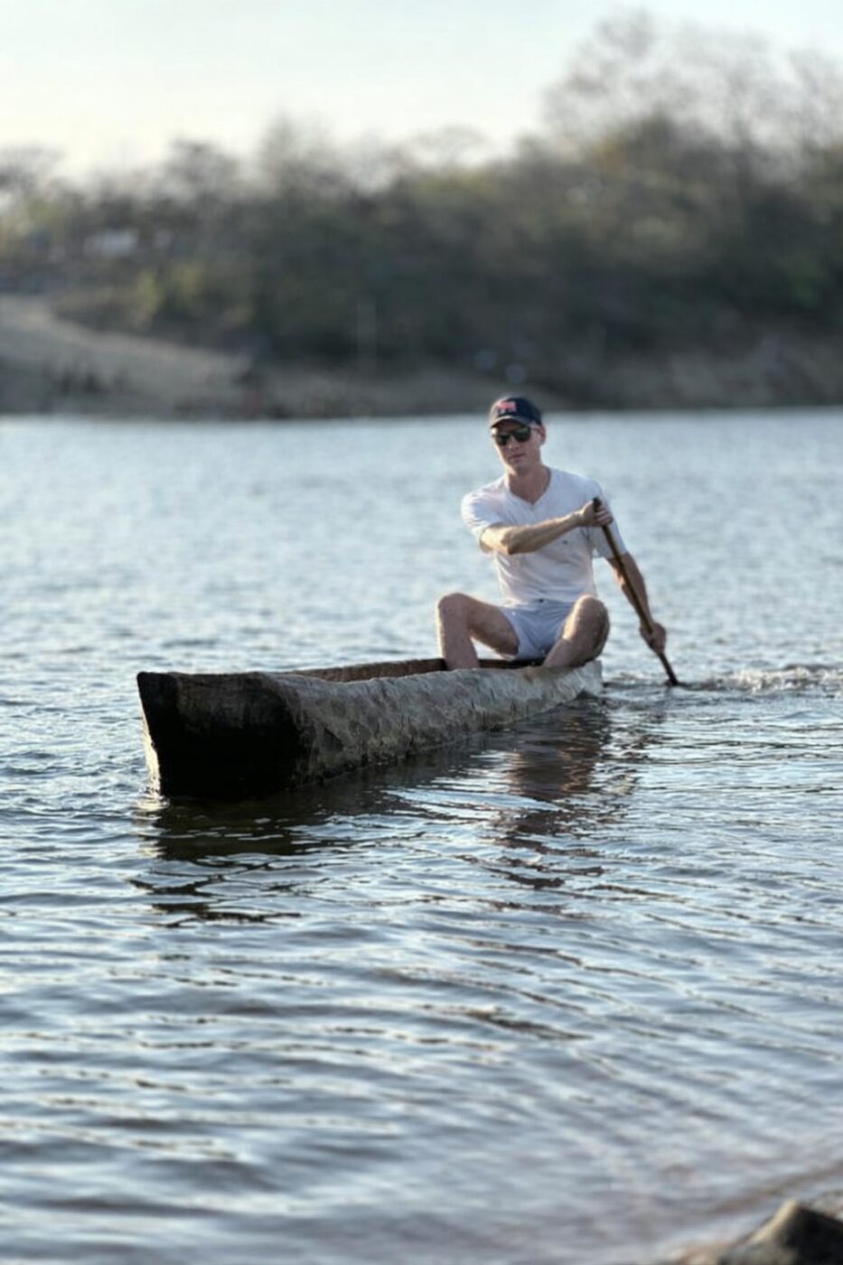 Guide poling a makoro canoe on the Kavango River