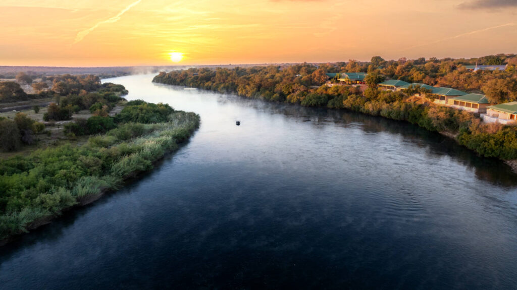 The Kavango River winding through riverine forest near Simanya River Lodge