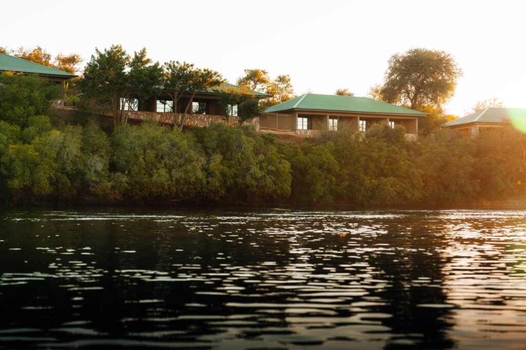 Simanya River Lodge on the riverbank at sunset
