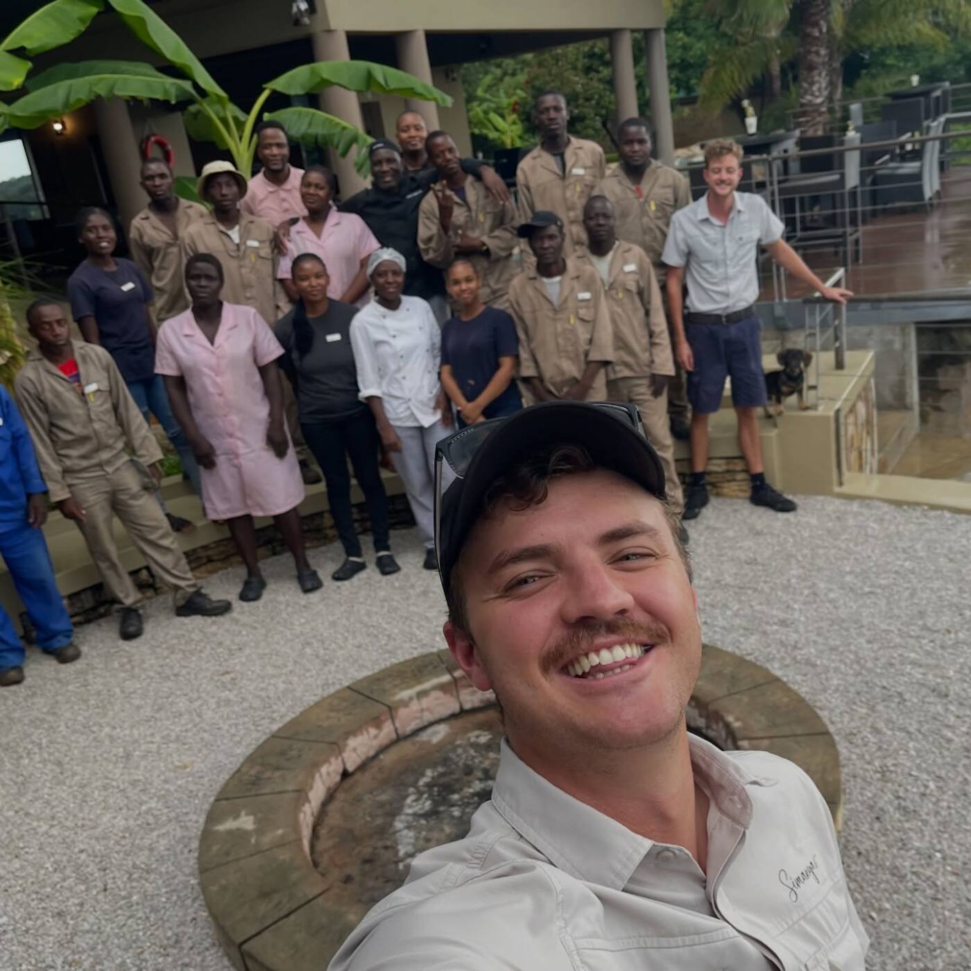 The Simanya team with a staff member taking a selfie